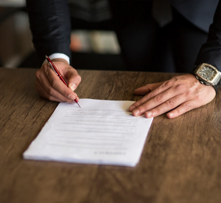 Lawyer signing papers